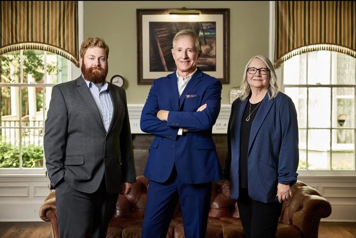 The Large Law team: Cooper McCoy, Michael Large, and Donna Hale
